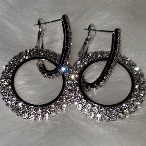 Silver pair of earrings